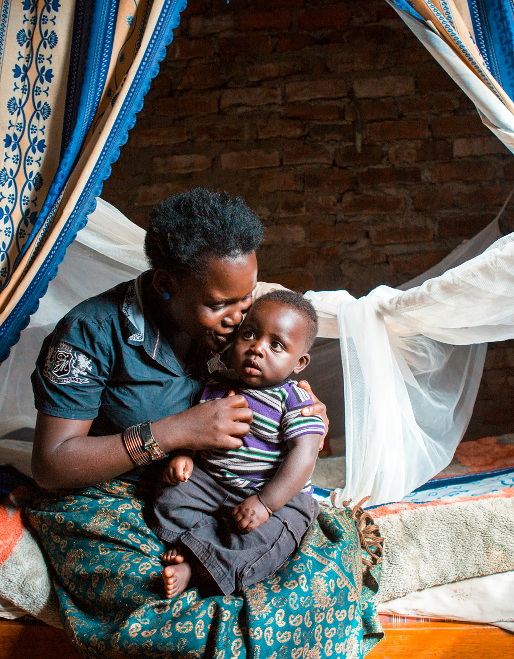 Mother and child with bed nets